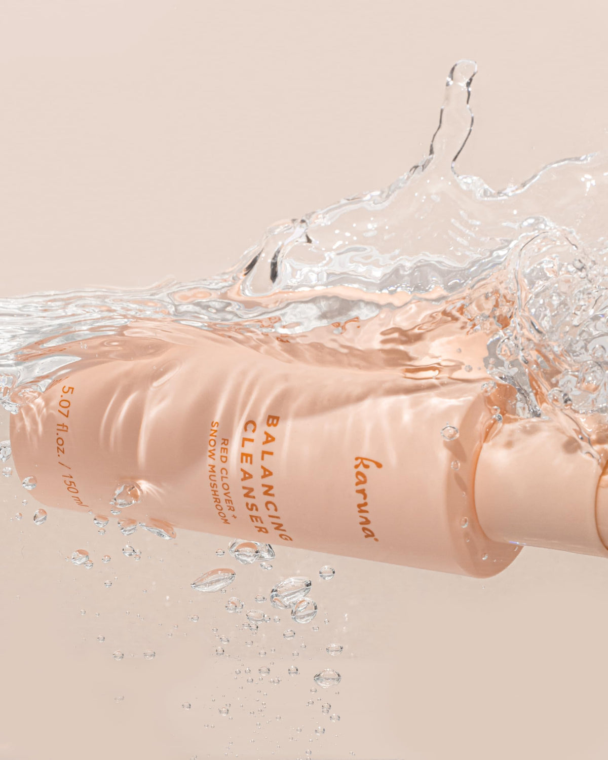 Karuna product alongside recyclable packaging showing eco benefit
