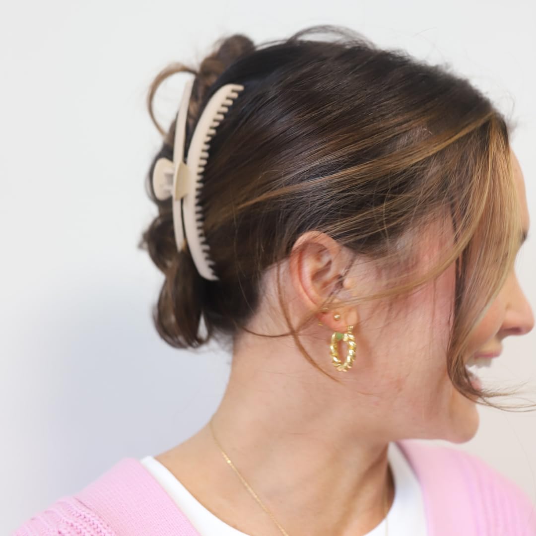 KAXI in-use securing a high bun for comfortable all-day wear