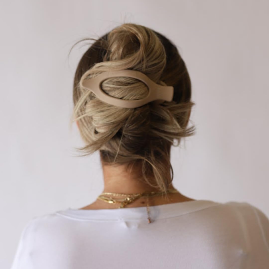 KAXI clip in hair demonstrating comfortable half-up hold during activity