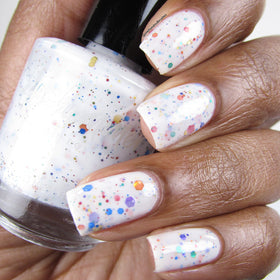 KBShimmer glitter texture close-up with rainbow flakes showing reflective sparkle benefit
