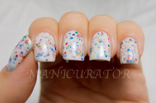 KBShimmer on-nail swatch on a hand showing how glitter contrasts with white base benefit
