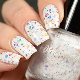 KBShimmer layered over black polish showing intense glitter pop benefit