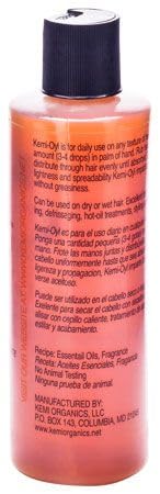 Kemi OYL application closeup on hands smoothing hair, improves manageability