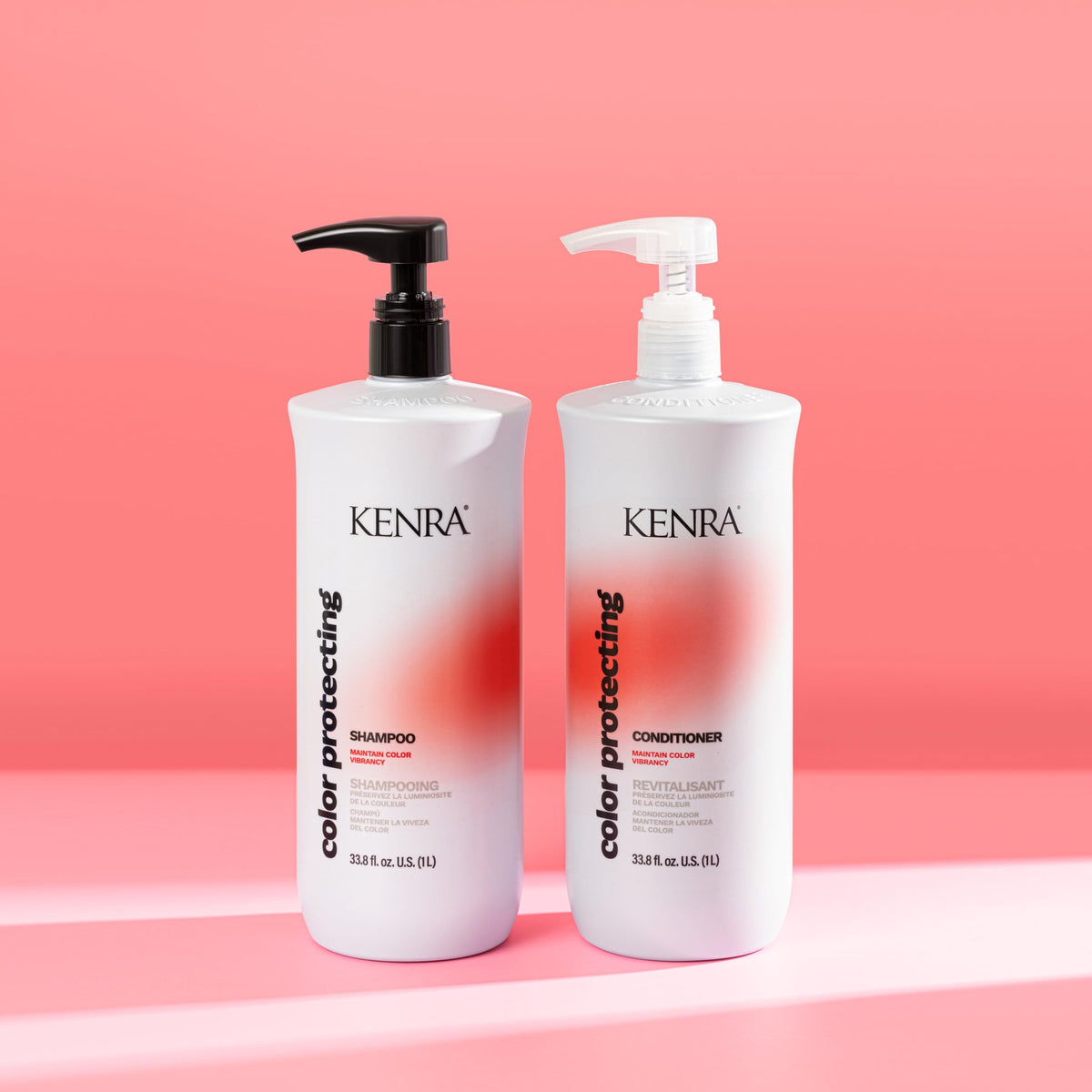 Kenra 33.8 fl oz bottle next to hand for size and value comparison