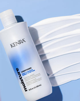 Kenra creamy conditioner texture on spoon conveying hydration and smoothness