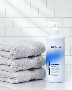 Kenra Moisture conditioner creamy texture on palm illustrating slip and hydration