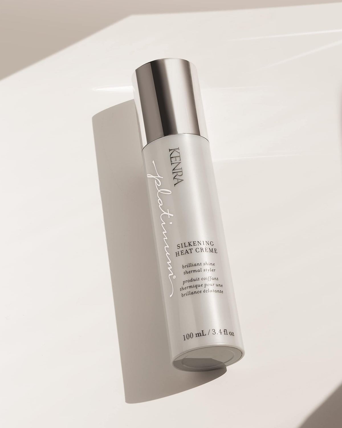 Kenra Platinum with a 3.4 fl oz scale comparison showing compact, travel-friendly size