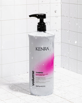Kenra volume conditioner pour showing creamy texture and glide