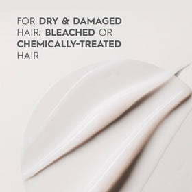 Kerasilk conditioner on bathroom shelf in lifestyle scene for salon-quality care
