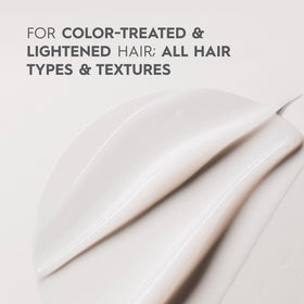 Kerasilk conditioner on bathroom shelf showcasing salon-care convenience