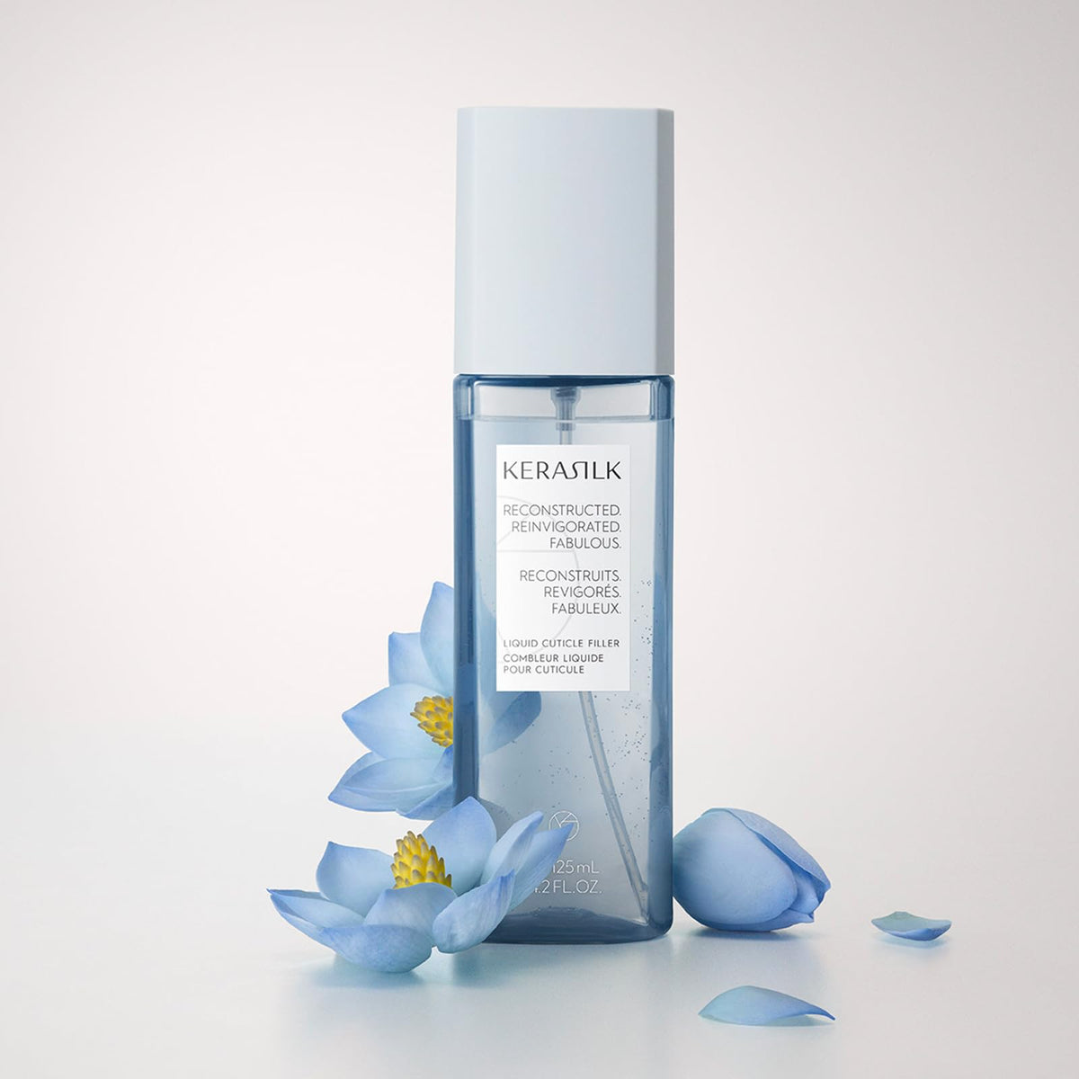 Kerasilk texture on fingertip, indicating lightweight non-greasy formulation
