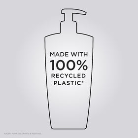 KÉRASTASE bottle in hand for scale showing travel-friendly strength benefit