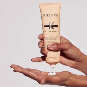 KÉRASTASE 5.07 fl oz next to a ruler for scale and travel readiness benefit