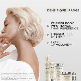KÉRASTASE held in hand showing 8.5 fl oz scale and portability benefit