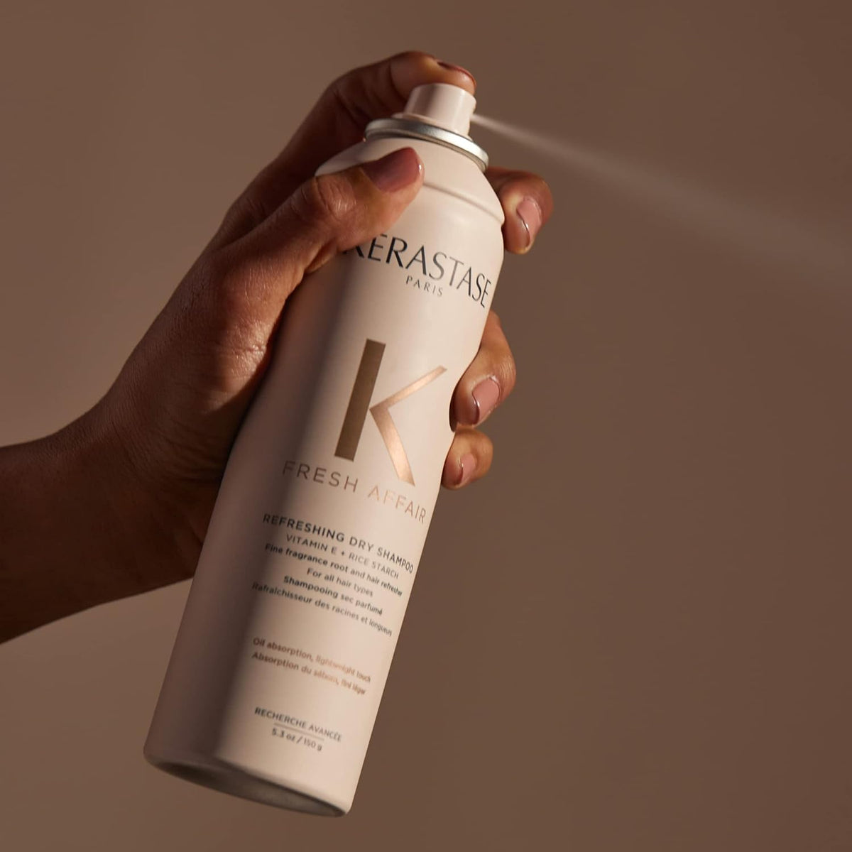 KÉRASTASE 5.3 oz can next to ruler showing true size for travel convenience