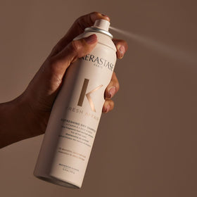 KÉRASTASE 5.3 oz can next to ruler showing true size for travel convenience