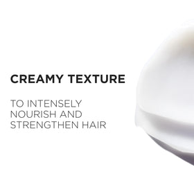 KÉRASTASE mask being rinsed in shower showing detangling benefit