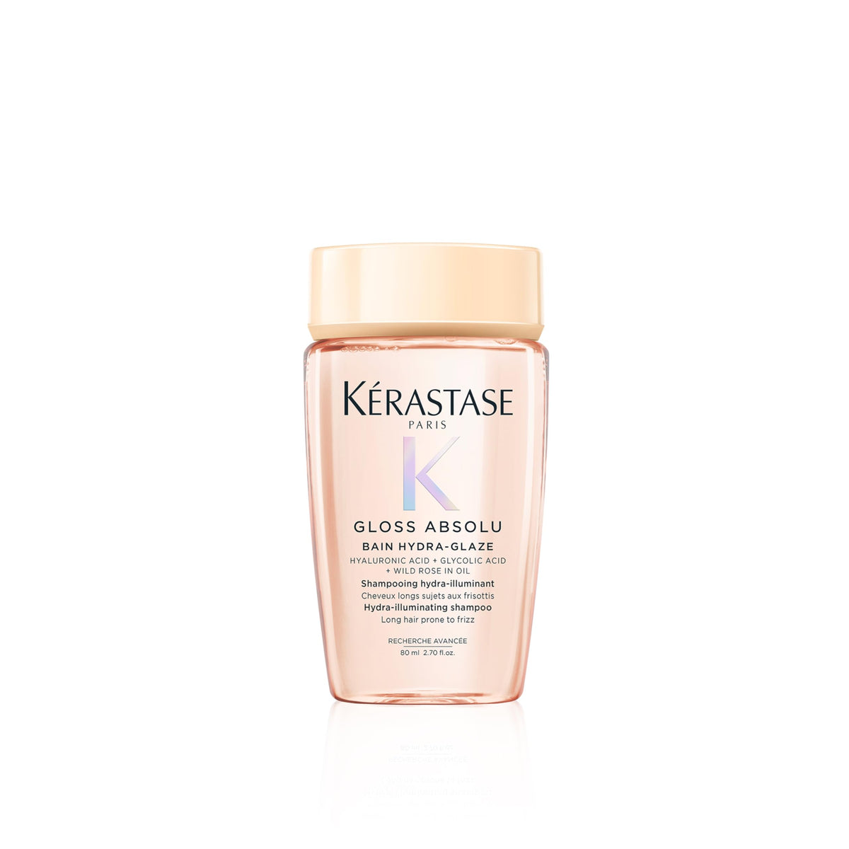 KÉRASTASE front packaging travel bottle shows brand and glossy benefit