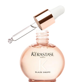 KÉRASTASE bottle front packaging showing glossy finish benefit