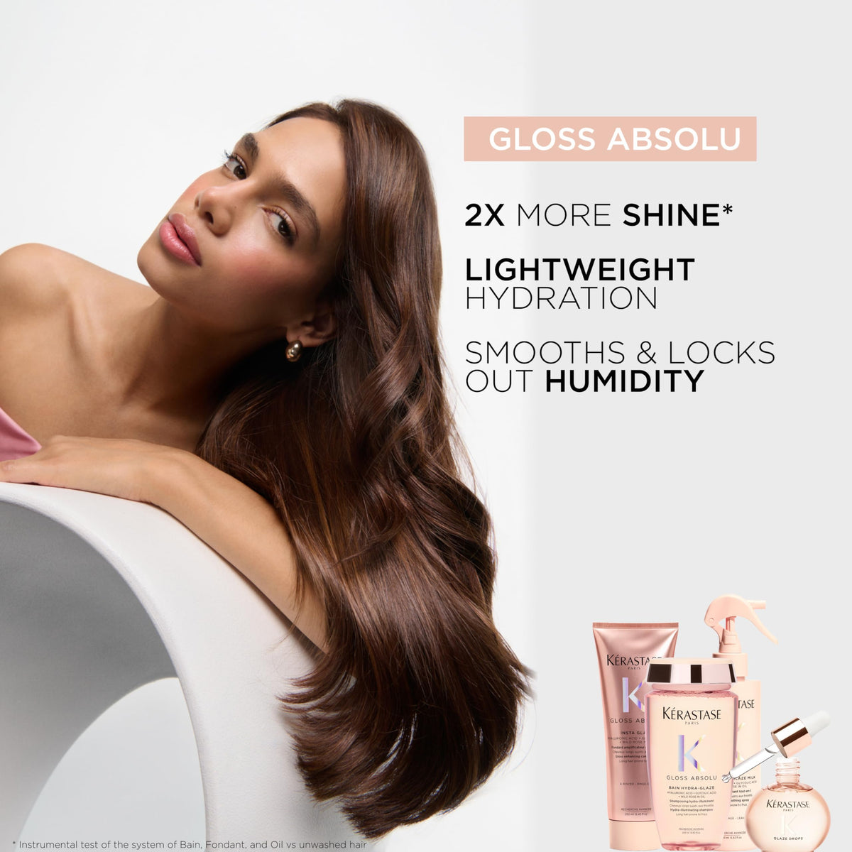 KÉRASTASE product on damp hair showing hydrated glossy strands