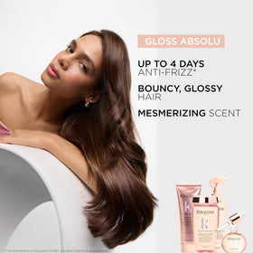 KÉRASTASE travel-size bottle in hand for size and portability benefit