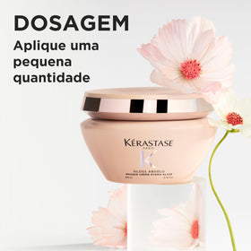 KÉRASTASE mask being applied to thick hair hands demonstrating smoother manageability