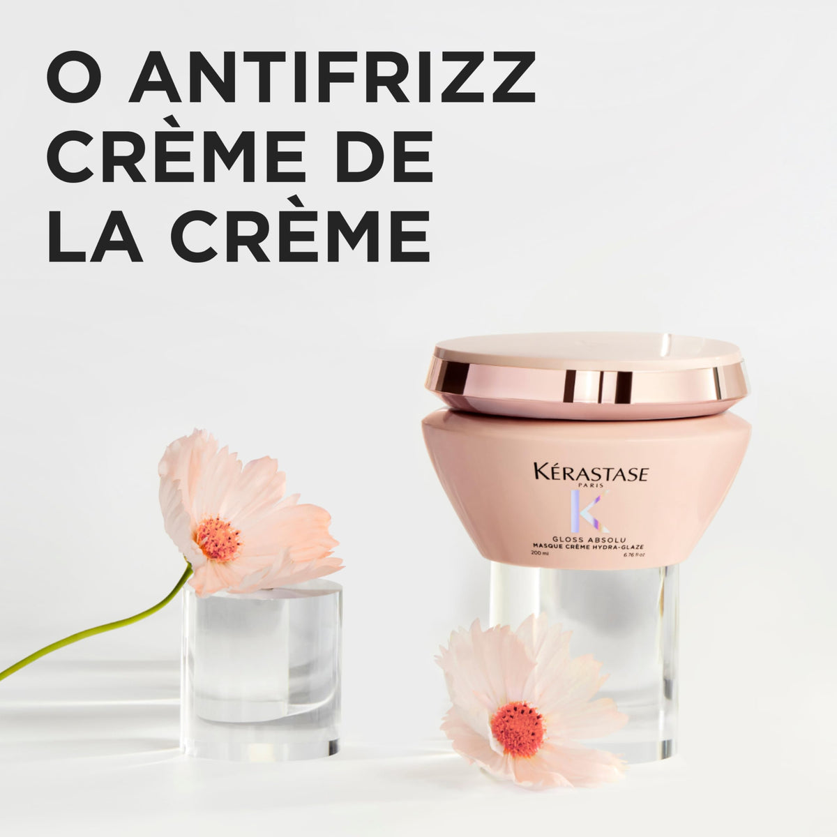 KÉRASTASE jar held in hand showing 6.8 fl oz scale and travel-friendly size