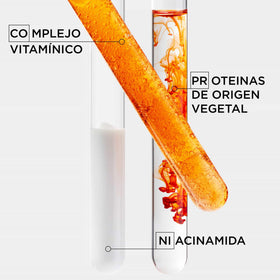 KÉRASTASE bottle in hand for scale conveying travel-friendly size and portability