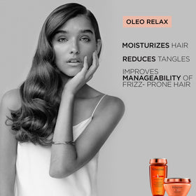 KÉRASTASE shampoo being lathered in shower providing gentle cleanse benefit