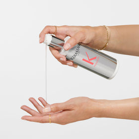 KÉRASTASE label ingredients close-up showing citric acid and glycine for stronger hair