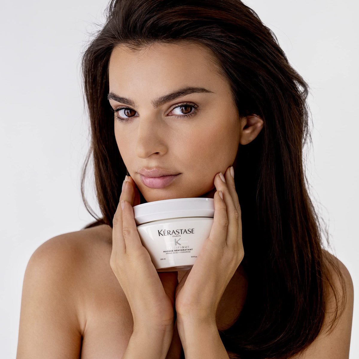KÉRASTASE jar on bathroom shelf styled in a routine setting conveying salon-quality home use