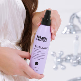 Keratin Complex next to a ruler showing 5 fl oz size for purchase clarity