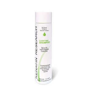 KERATIN RESEARCH 10oz bottle next to a ruler shows compact size and travel-friendly benefit