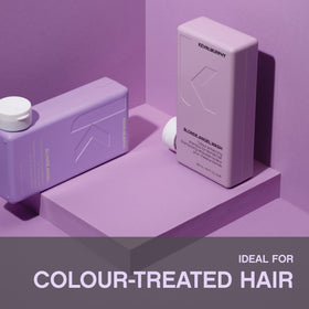 KEVIN.MURPHY 250ml bottle beside a hand for size reference and travel convenience