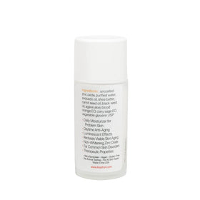 Keys Luminos PLUS cream texture close-up on fingertip, shows hydrating finish and zinc oxide benefit