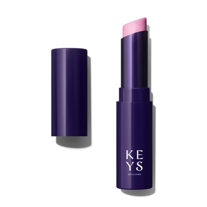 Keys Soulcare front-facing balm tube showing shade and compact design benefit