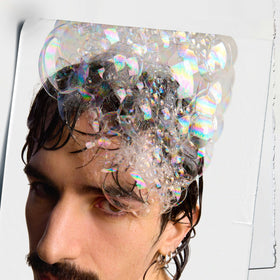 Kiehl's creamy shampoo texture close-up for visible smoothness benefit