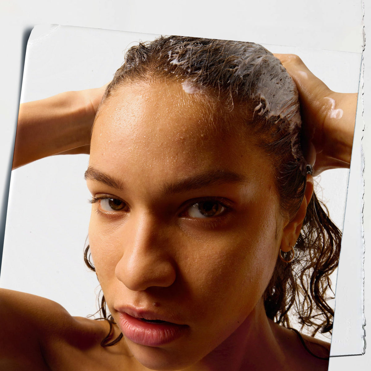 Creamy texture of Kiehl's conditioner demonstrating smooth spreadability