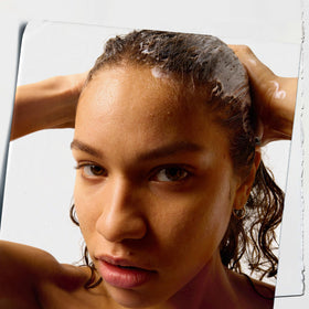 Creamy texture of Kiehl's conditioner demonstrating smooth spreadability