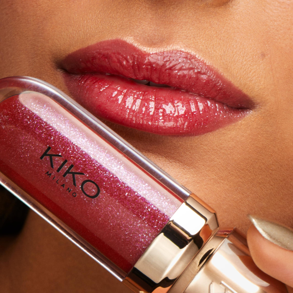 KIKO Milano lifestyle handshot with gloss applied illustrating radiant, fuller-looking lips