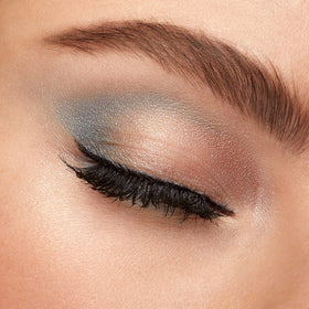 Kiko Milano palette open with mirror in use for quick touch-ups and precision