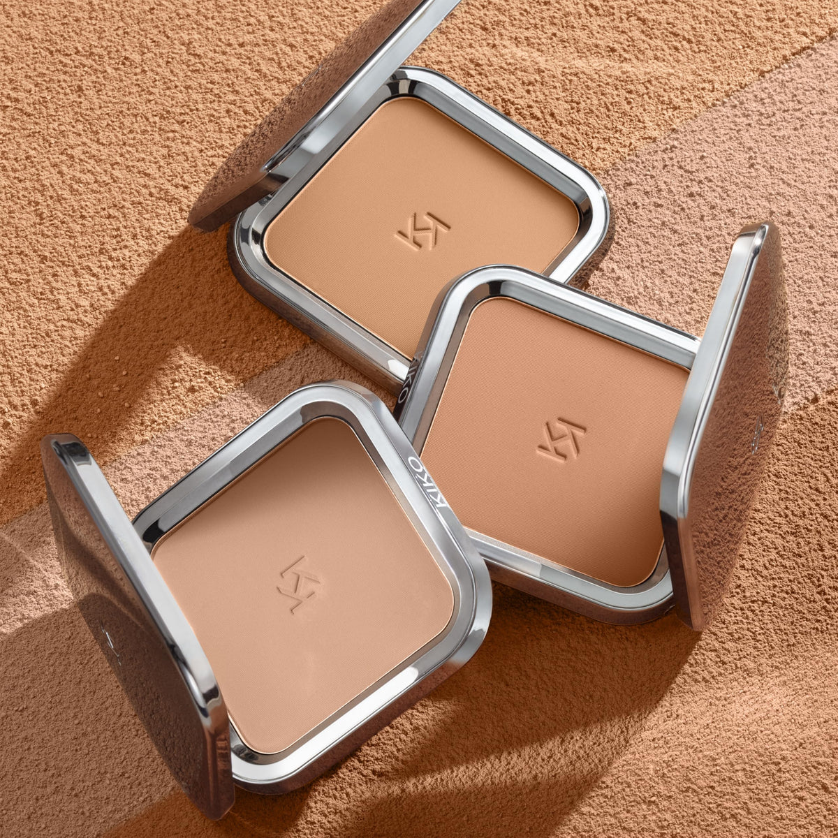 KIKO Milano bronzer open in hand with mirror showing on-the-go touch-up convenience