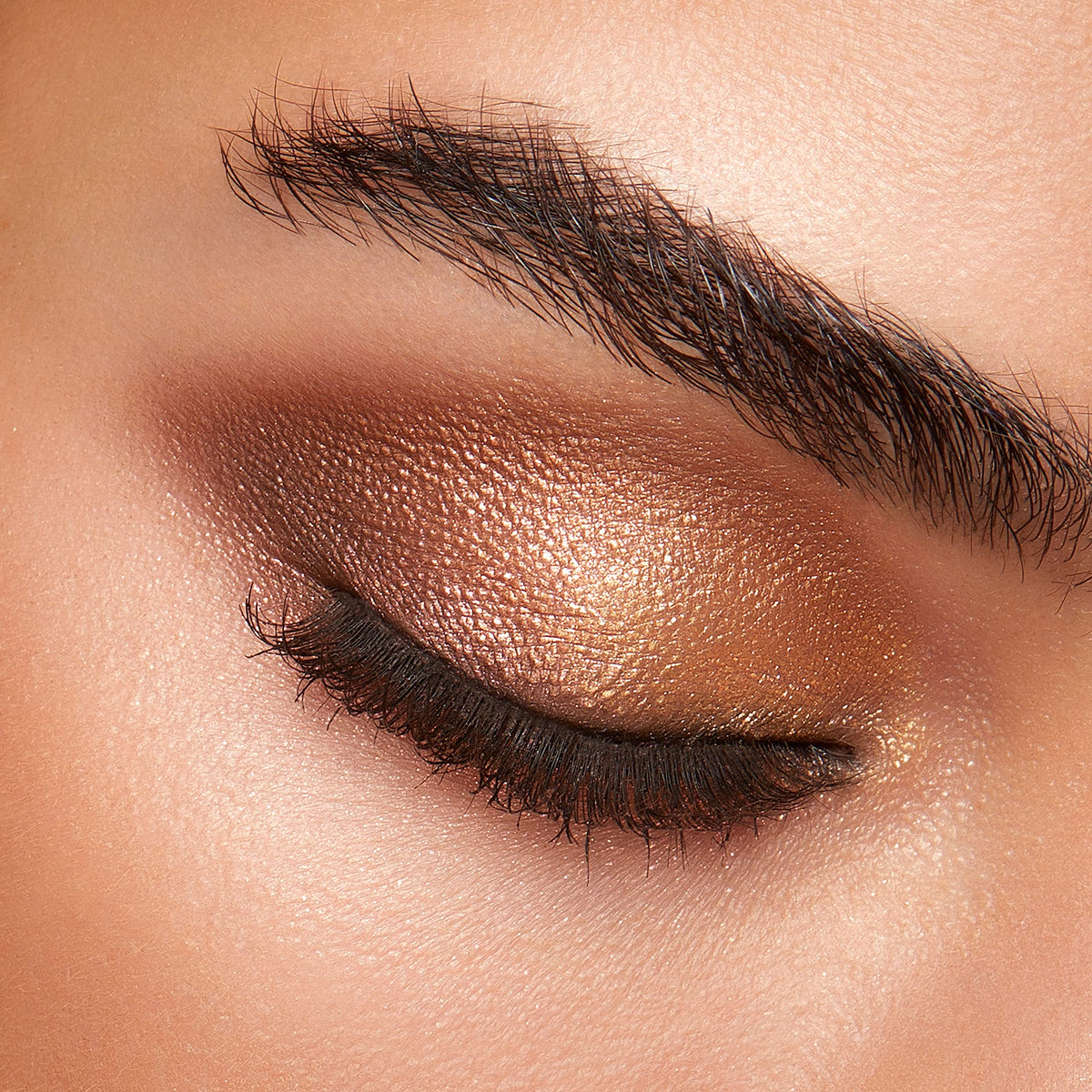 Kiko Milano close-up of marbled and sparkly shadows, visible texture and payoff benefit