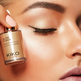 KIKO Milano bottle beside coin to show size and portability benefit