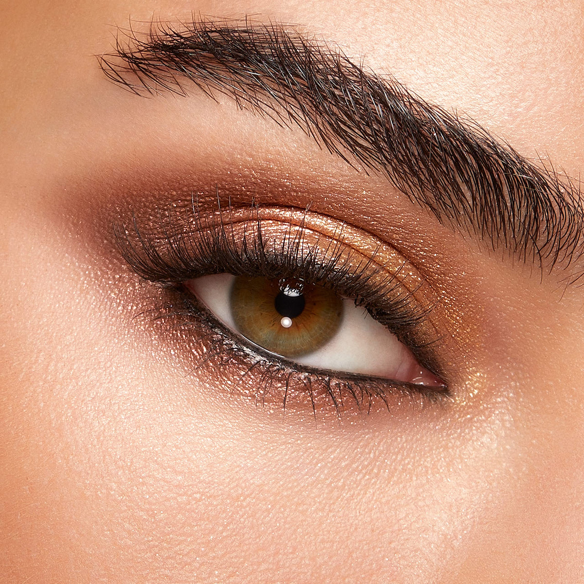 Kiko Milano palette in use by model using mirror, easy on-the-go touch-up benefit