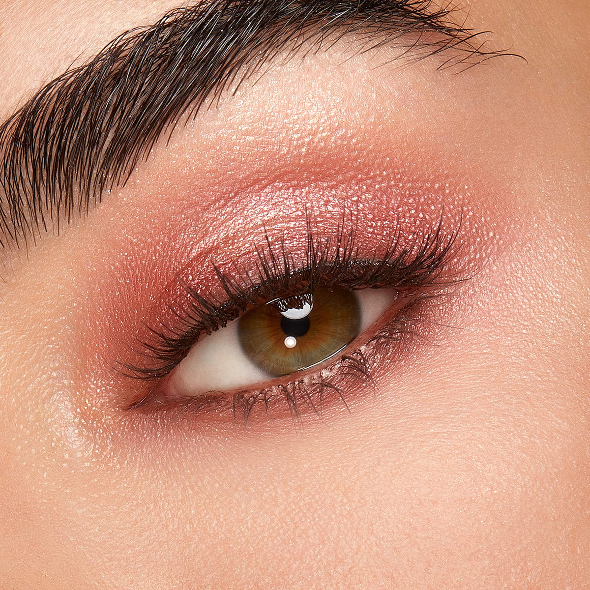 Kiko Milano palette held in hand to show compact size and travel convenience
