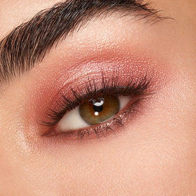 Kiko Milano palette held in hand to show compact size and travel convenience