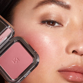 KIKO Milano blush held in hand to show size and travel-friendly case for on-the-go use