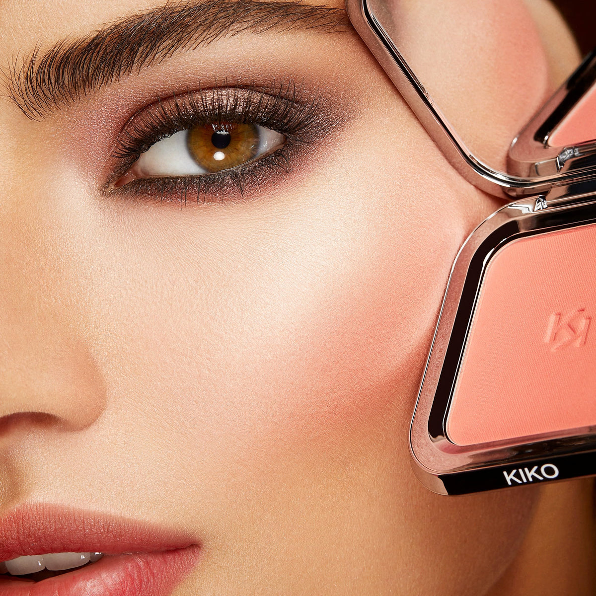 KIKO Milano blush in a handbag lifestyle shot demonstrating on-the-go touch-up convenience