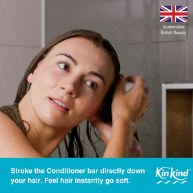 KinKind bars producing lather in shower, demonstrating gentle cleanse for scalp